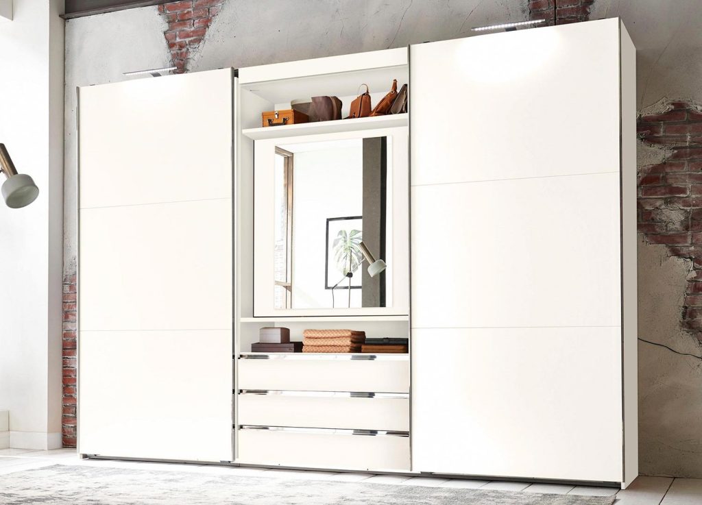 Armoire à portes coulissantes avec miroir pivotant