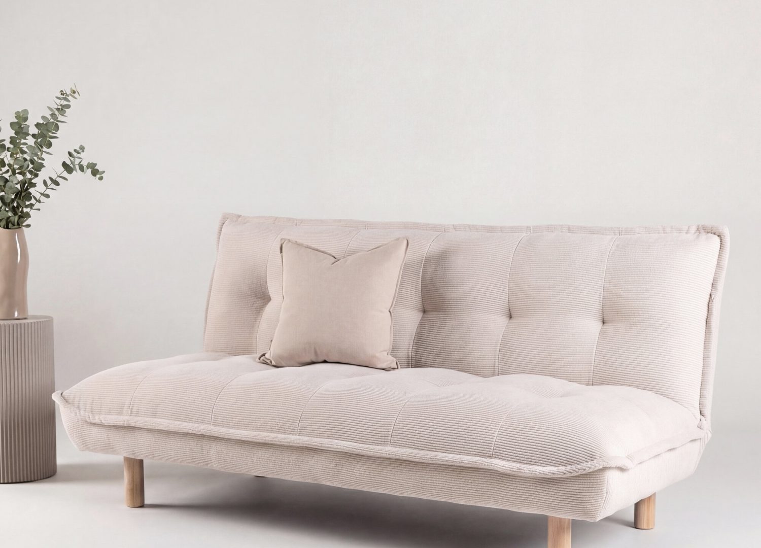 Canapé convertible 2 places Gertrud velours côtelé beige 182 cm présenté dans une ambiance de salon