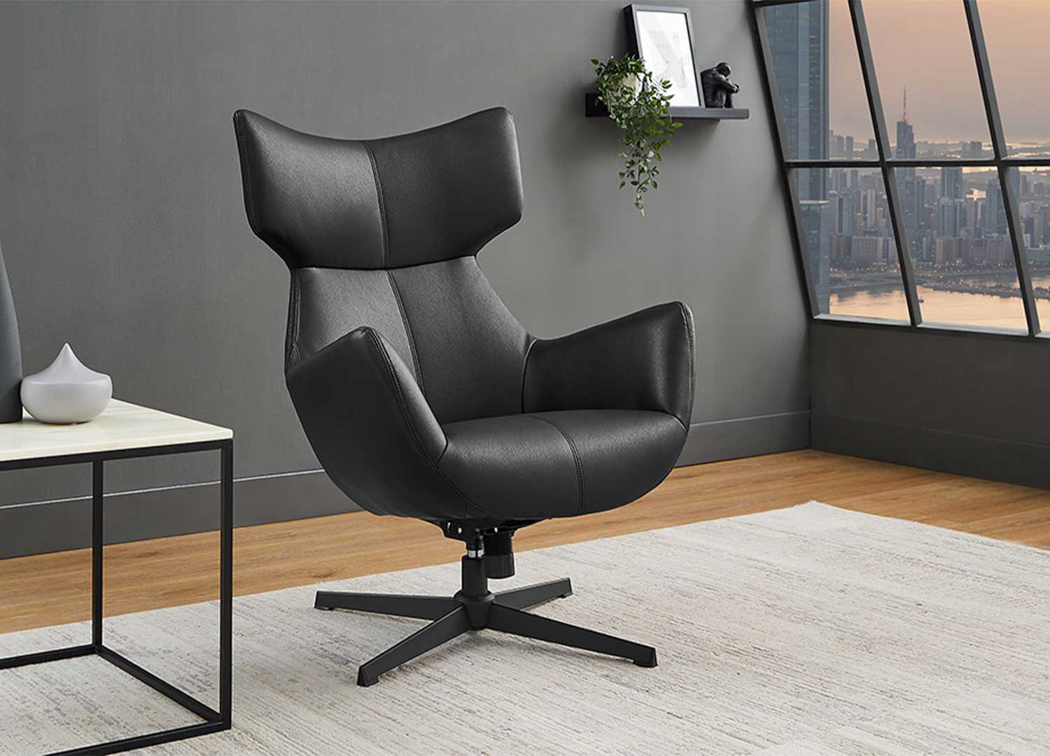 Fauteuil à oreilles pivotant simili cuir noir Jade