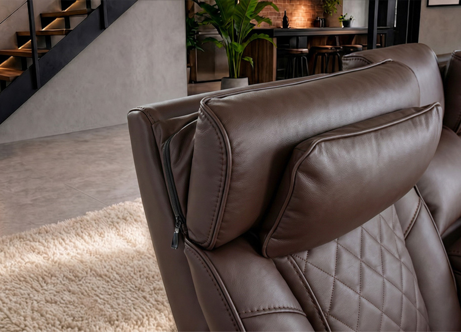 Détail des têtières rembourrées du fauteuil cinéma Cinélio marron