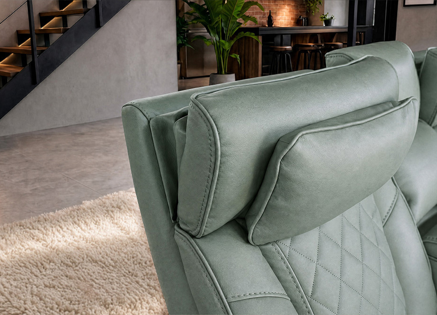 Détail des têtières rembourrées du fauteuil cinéma Cinélio vert sauge