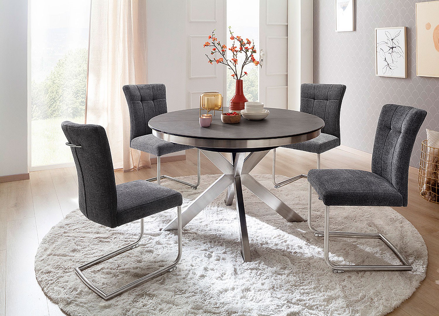 Table à manger ronde céramique anthracite et pied acier brossé