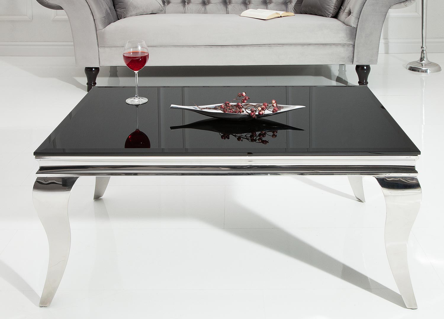 Table basse baroque verre opale noir et pied en acier poli