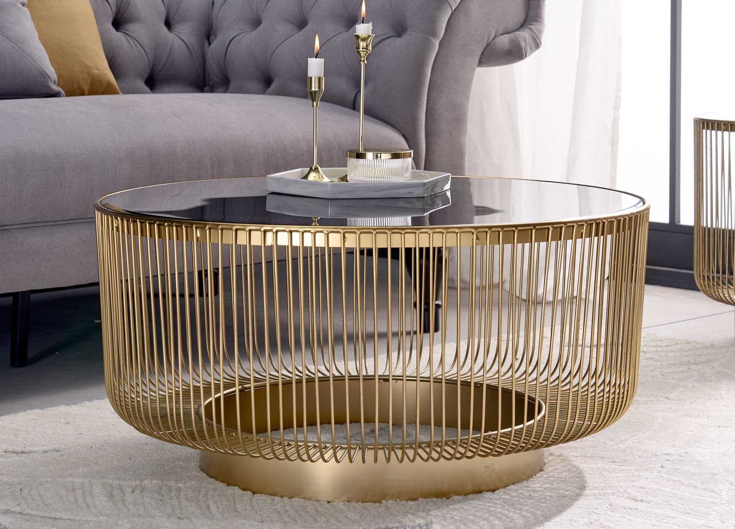 Table basse ronde verre noir et métal doré