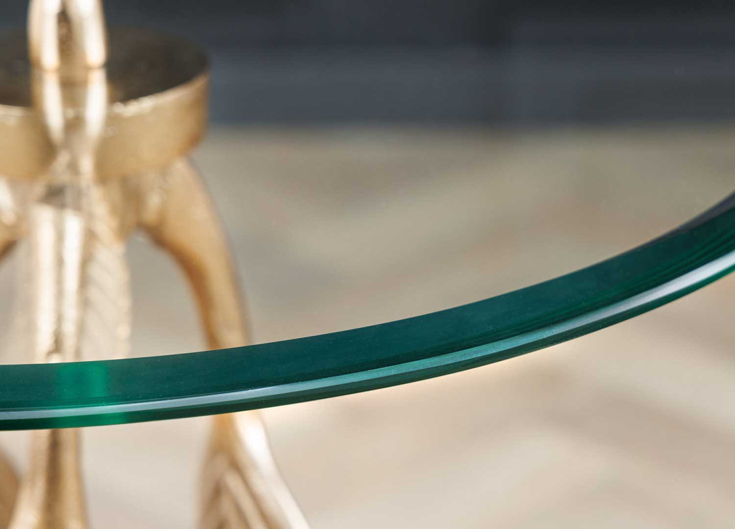 Table d'appoint ronde en verre et décor feuille en métal doré