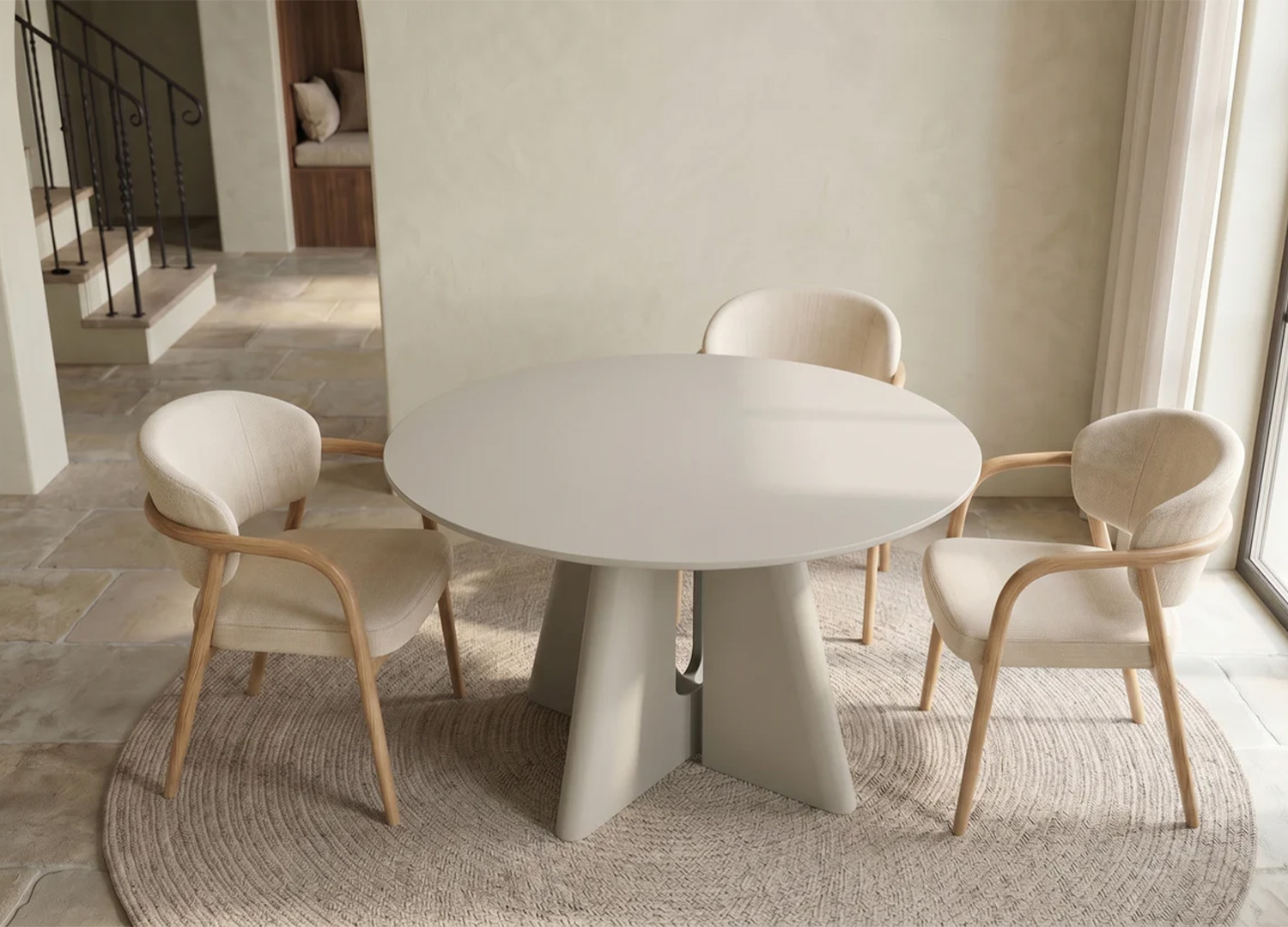 Table Ovélis ronde gris ciment dans une ambiance de salle à manger chaleureuse